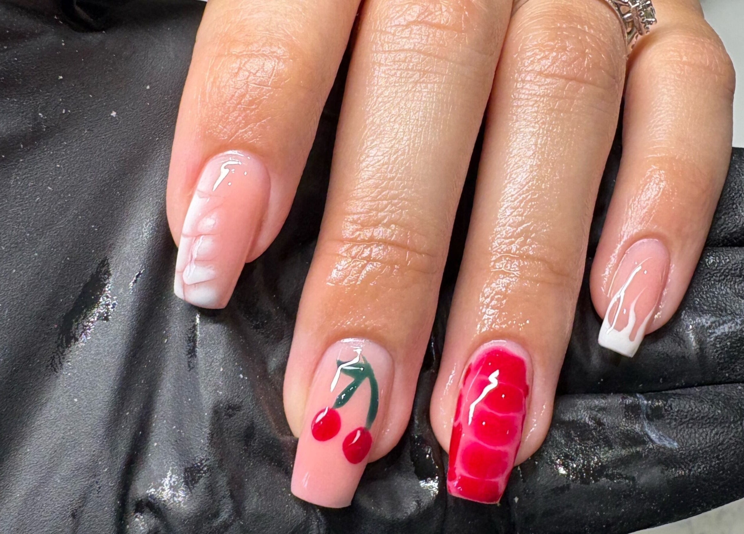 Stylish cherry nail art at Elizabeth Zara Nails & Beauty, Sutton Coldfield, England, GB. Elegant and vibrant.