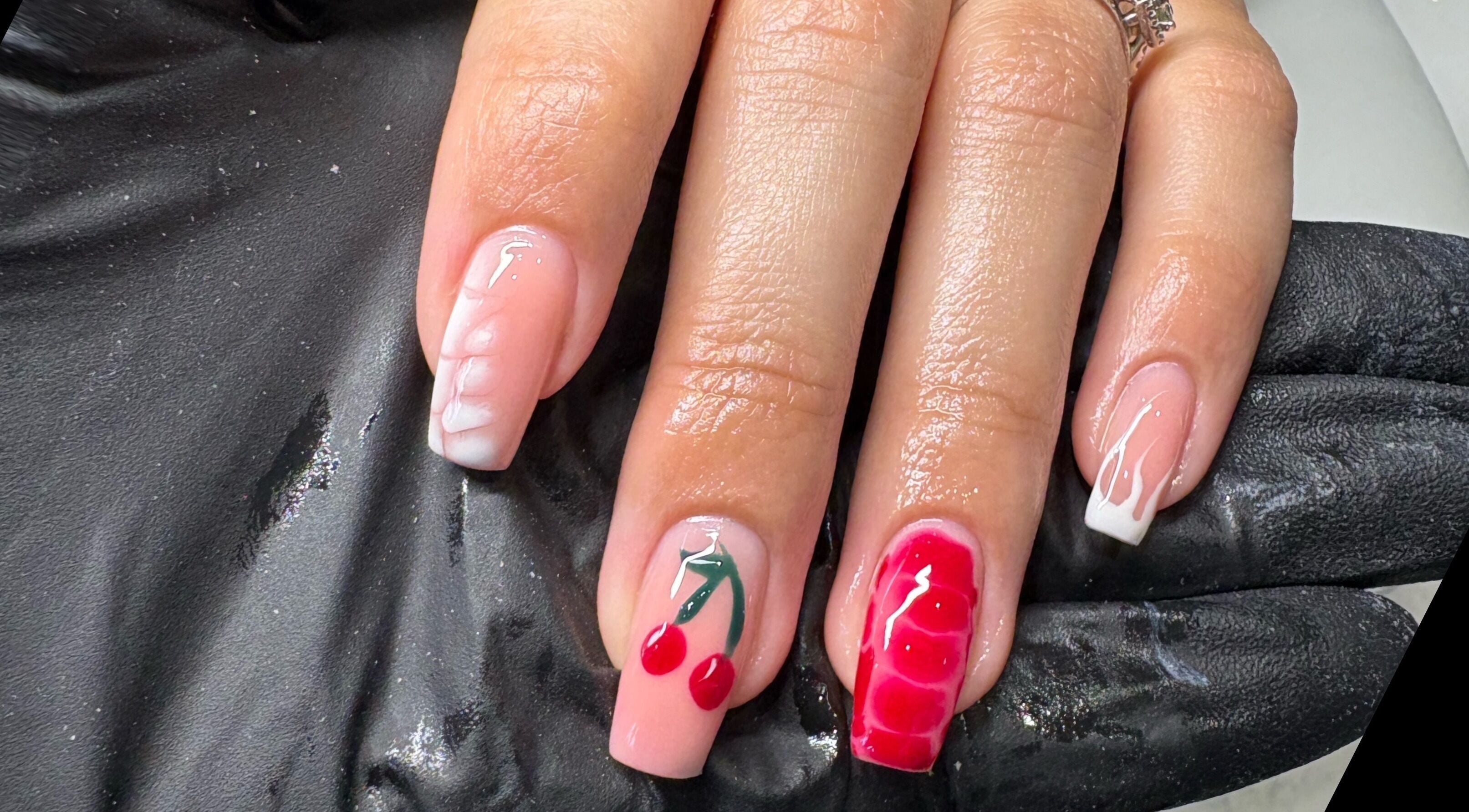 Stylish cherry nail art at Elizabeth Zara Nails & Beauty, Sutton Coldfield, England, GB. Elegant and vibrant.