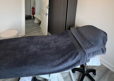 Cozy treatment room with plush towel at HD Skin Clinic Lancs, Chorley, England, GB for ultimate relaxation.