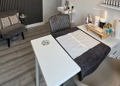 Nail treatment area at HD Skin Clinic Lancs, Chorley, England with a cozy chair and modern decor.