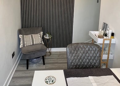 Elegant treatment room at HD Skin Clinic Lancs in Euxton, England, GB, featuring a stylish chair and products.