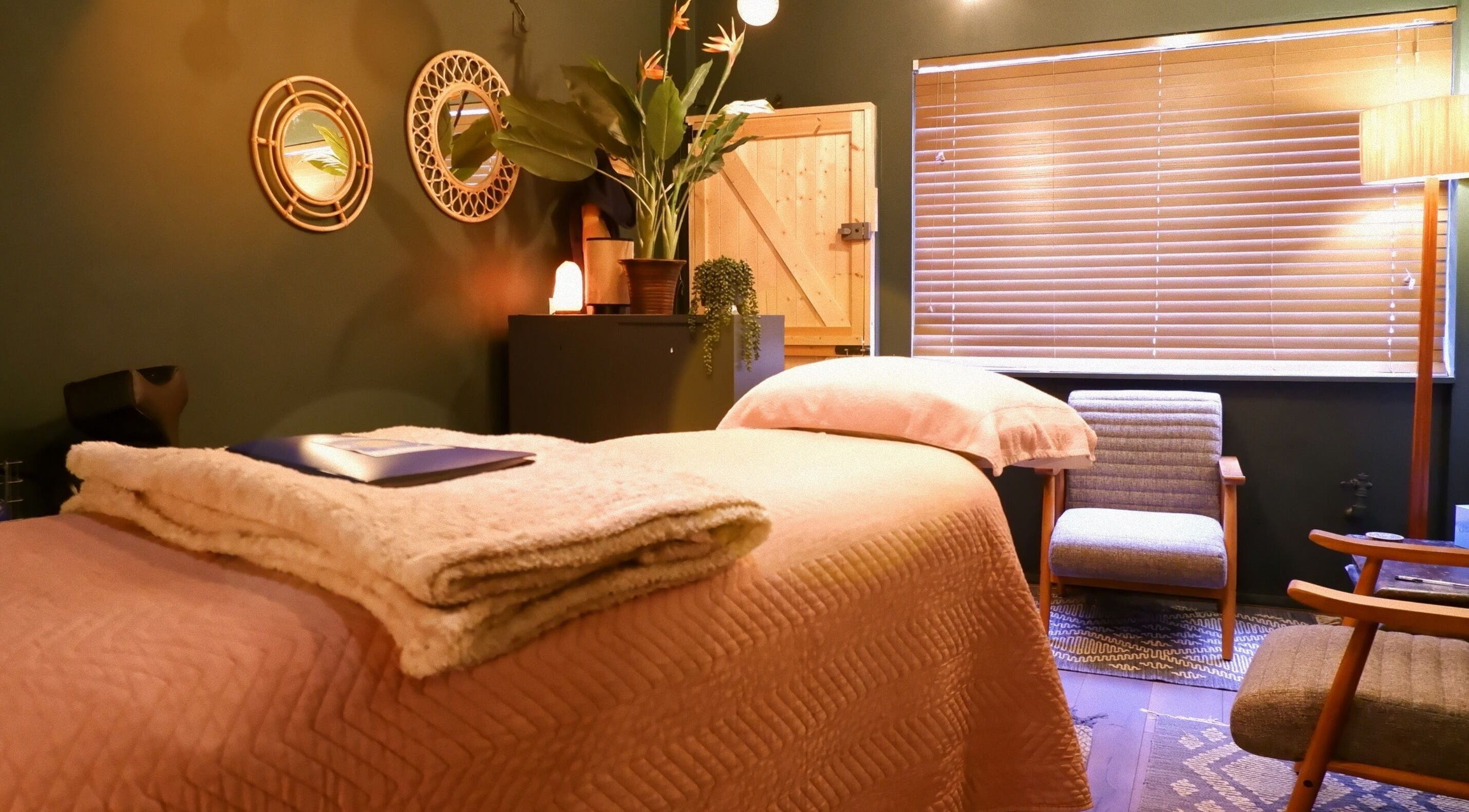 Calming therapy room at Sacred Harmony Reiki & Coaching, London, England, GB with soft lighting and cozy decor.