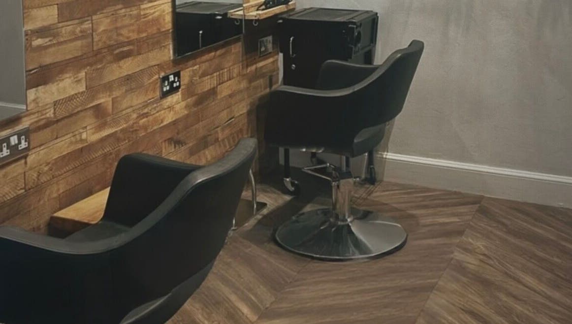 Stylish salon chairs at Emma James-Creative Salon, North Berwick, Scotland, GB with chic wooden decor.