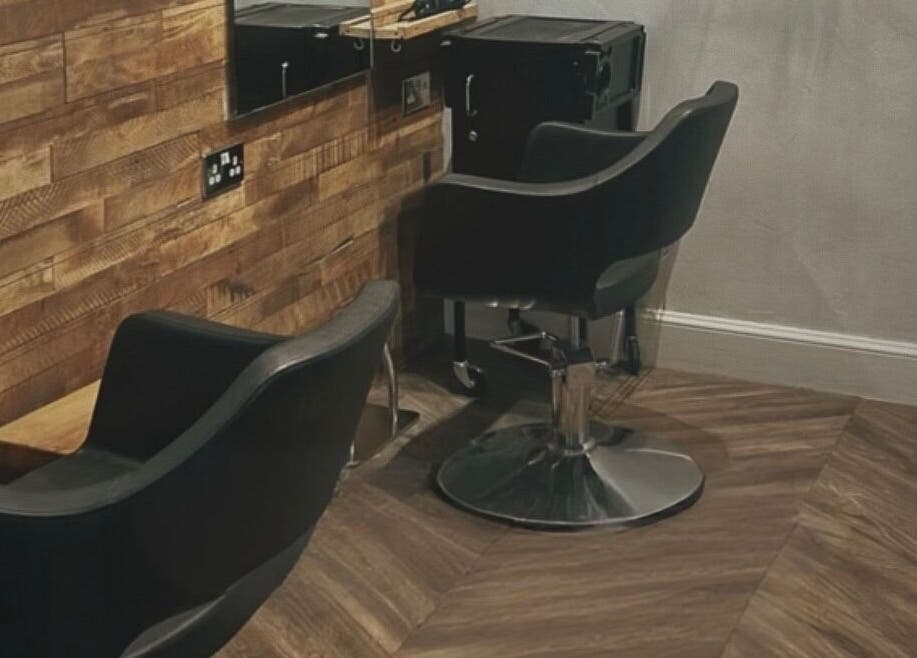 Stylish salon chairs at Emma James-Creative Salon, North Berwick, Scotland, GB with chic wooden decor.