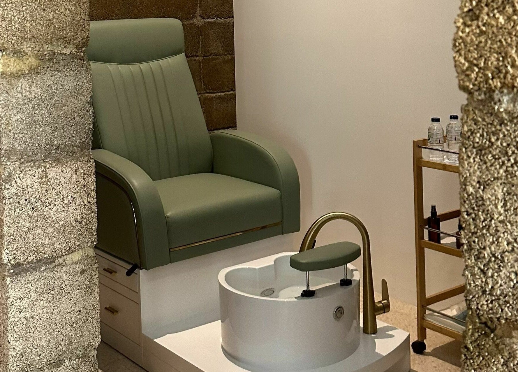 Luxurious pedicure station at Float Barbershop, Sharjah, Sharjah, AE, featuring a stylish green chair.