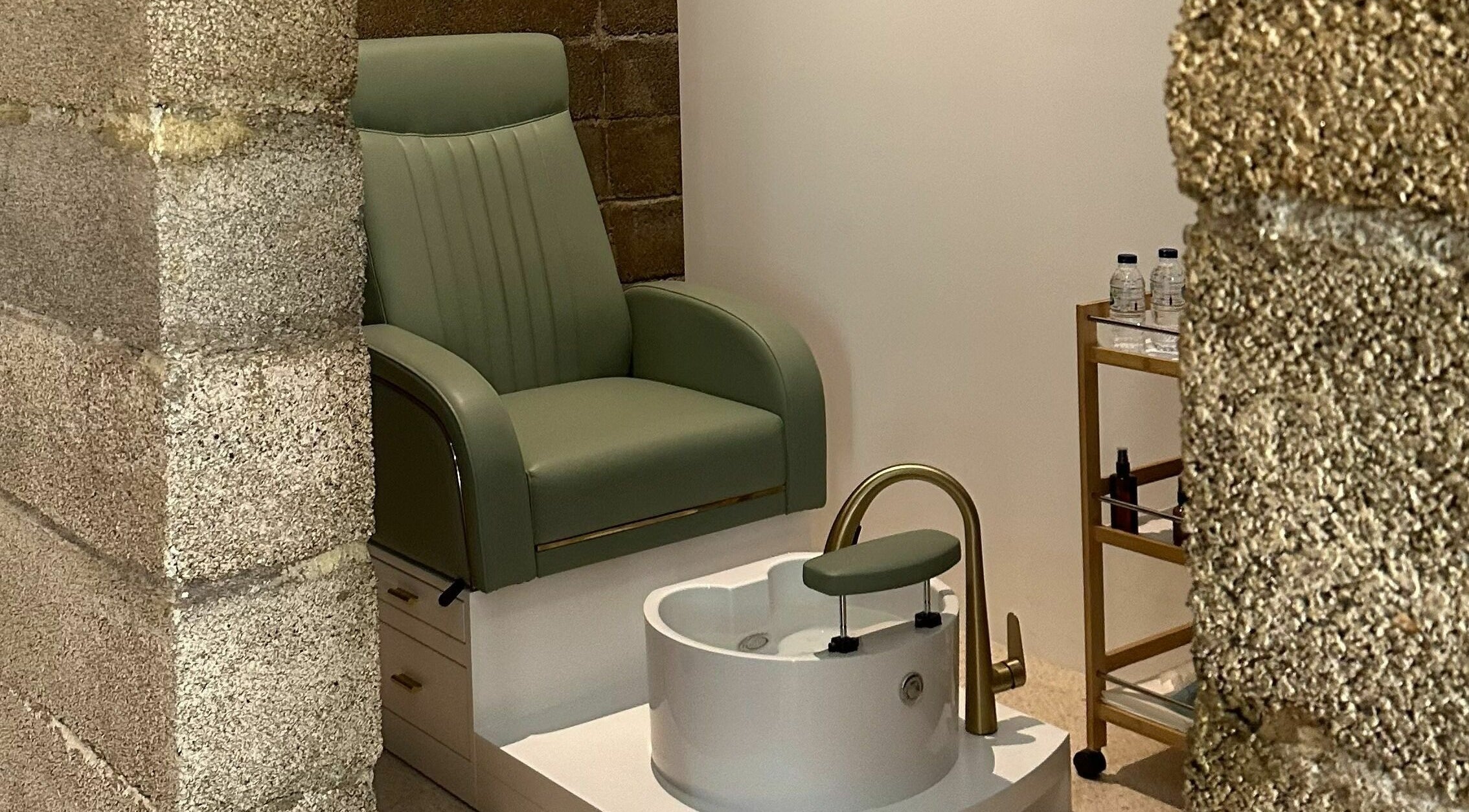 Luxurious pedicure station at Float Barbershop, Sharjah, Sharjah, AE, featuring a stylish green chair.