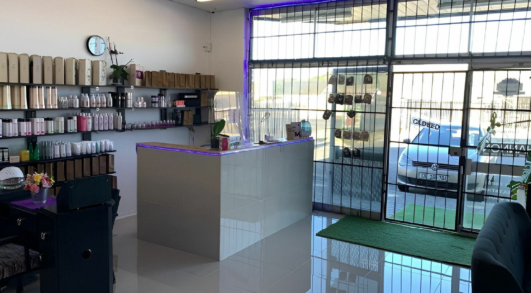 Be-dazzle Strandfontein reception area with sleek design and product shelves, Cape Town, Western Cape, ZA.