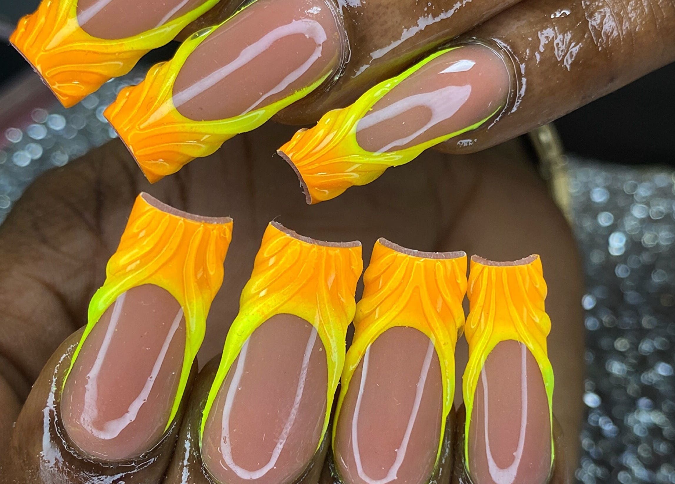 Vivid neon orange and yellow flame nail art at K’ Oari Nail Artistry, Potters Village, Saint John, AG.