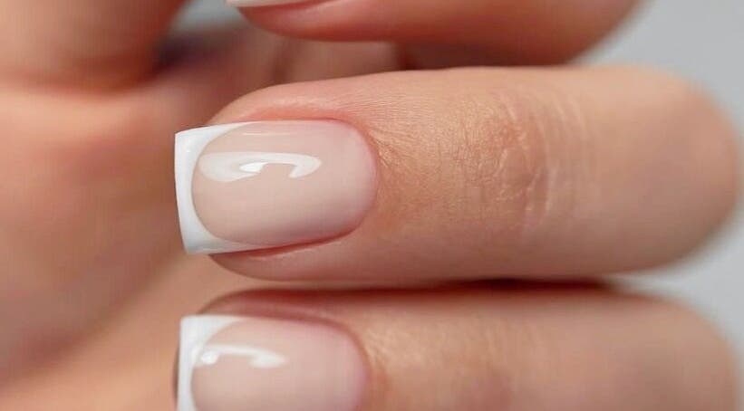 Elegant French manicure at Nails & Co, Glendale, California, US, showcasing flawless nail art.