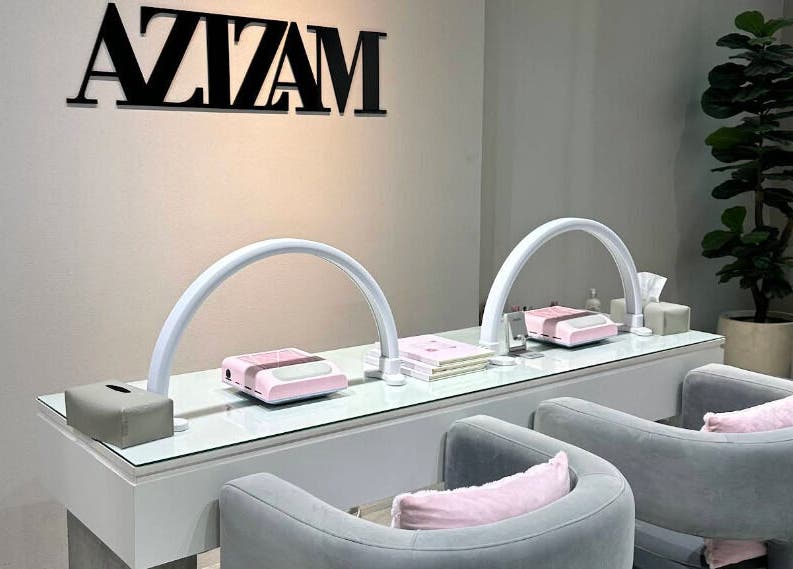 Sophisticated interior of Azizam - Lashes & Brows, Dubai, AE, featuring sleek workstations and comfy seating.