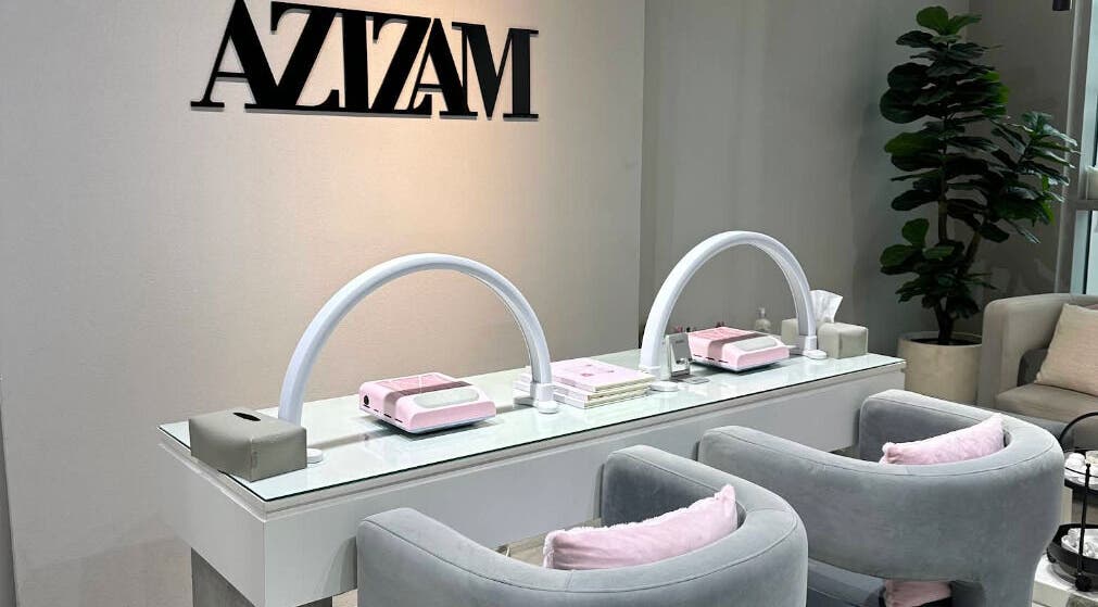 Sophisticated interior of Azizam - Lashes & Brows, Dubai, AE, featuring sleek workstations and comfy seating.