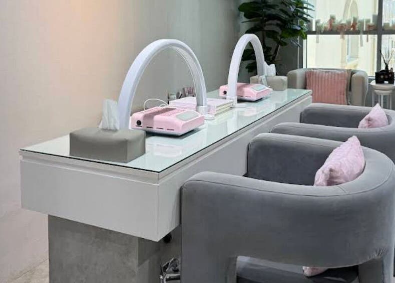 Modern beauty station at Azizam - Lashes & Brows, Dubai, AE, with plush seating and stylish decor.