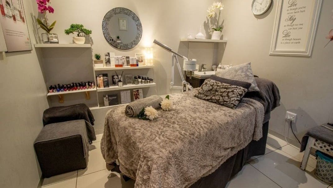 Tranquil spa room at Cindy’s Skincare at Tiffanys, Dolphin Coast, Kwazulu-natal, ZA, with plush treatment bed.