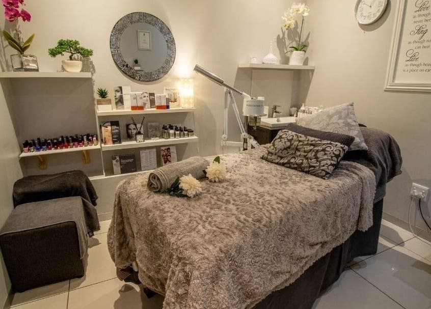 Tranquil spa room at Cindy’s Skincare at Tiffanys, Dolphin Coast, Kwazulu-natal, ZA, with plush treatment bed.
