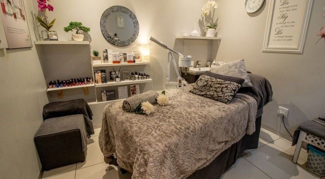 Tranquil spa room at Cindy’s Skincare at Tiffanys, Dolphin Coast, Kwazulu-natal, ZA, with plush treatment bed.