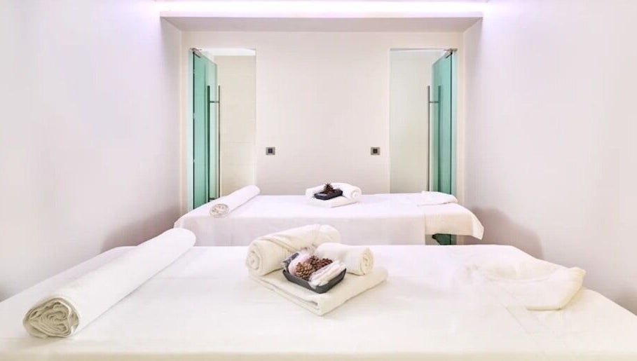 Elegant spa room at Wellness - Hotel Parentium, Poreč, Istarska Županija, HR with massage tables and soft towels.