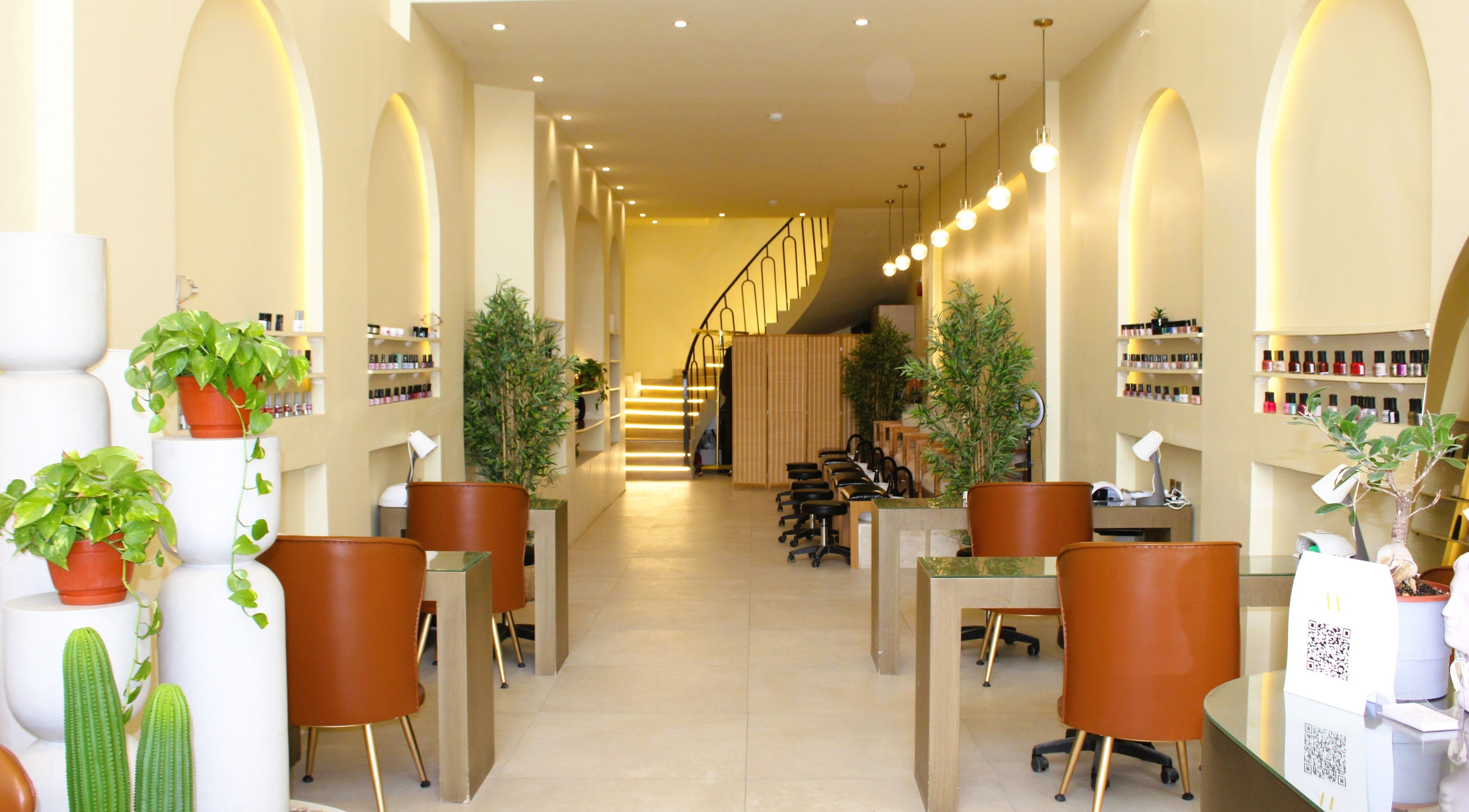 Stylish interior of Amal’s venue nail & hair in Riyadh, Riyadh Province, SA with modern decor and plants.