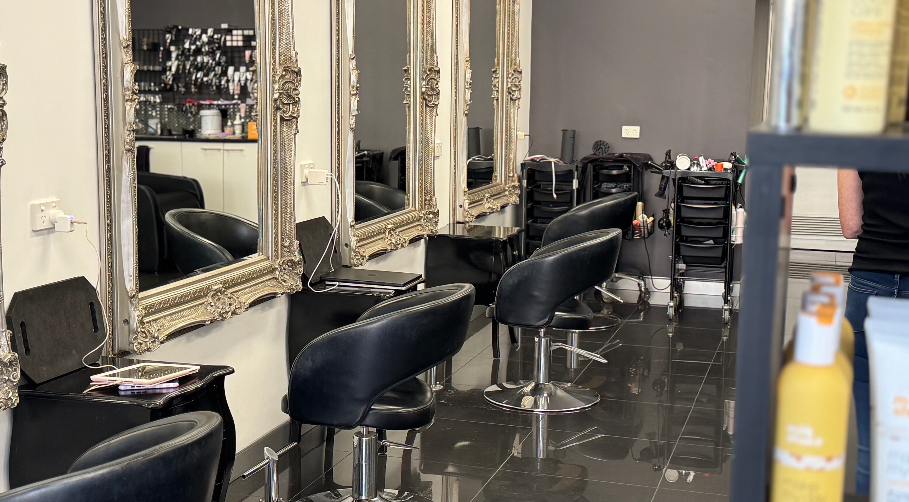 Luxurious interior of Capelli Bliss Hair and Beauty in Wellington Point, Queensland, AU with stylish salon chairs.