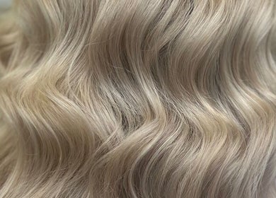 Blonde wavy hair styled by Hair by Suzie - Mobile Hairdresser in Cheshunt, Enfield, GB.