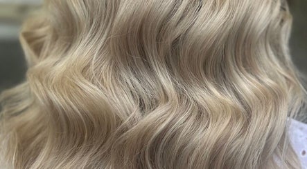 Blonde wavy hair styled by Hair by Suzie - Mobile Hairdresser in Cheshunt, Enfield, GB.