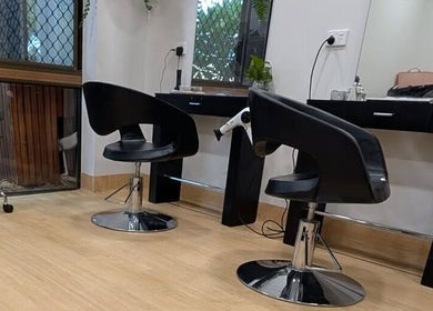 Modern salon setup at Arlu Style House, Goondiwindi, Queensland, AU with sleek black chairs and mirrors.