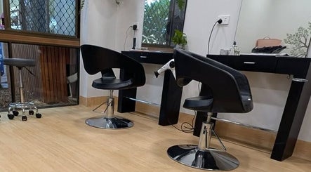 Modern salon setup at Arlu Style House, Goondiwindi, Queensland, AU with sleek black chairs and mirrors.