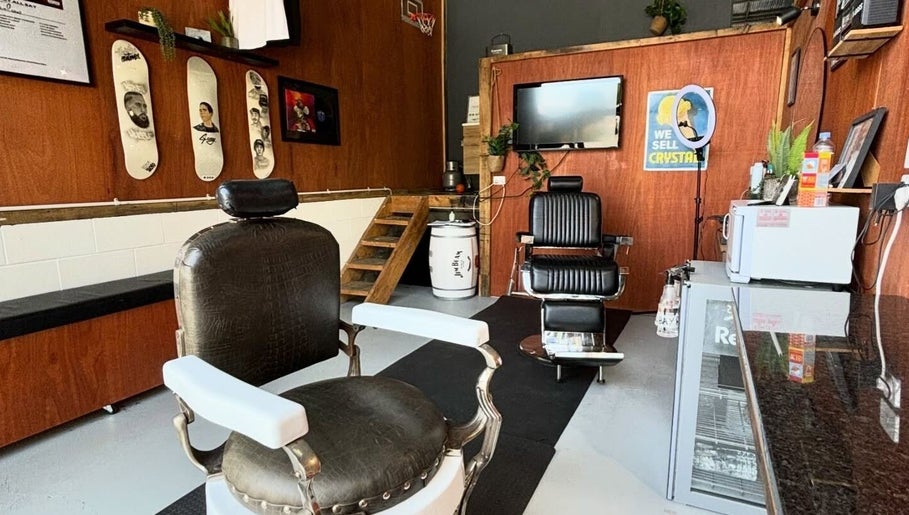 Interior of Stay Cut Barbers in Paraparaumu, Wellington, NZ, featuring stylish chairs and decor.