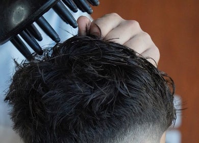 Precision haircut at Stay Cut Barbers in Paraparaumu, Wellington, NZ with a hair dryer in use.
