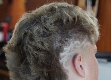 Creative undercut hairstyle at Stay Cut Barbers, Paraparaumu, Wellington, NZ showcasing intricate hair design.
