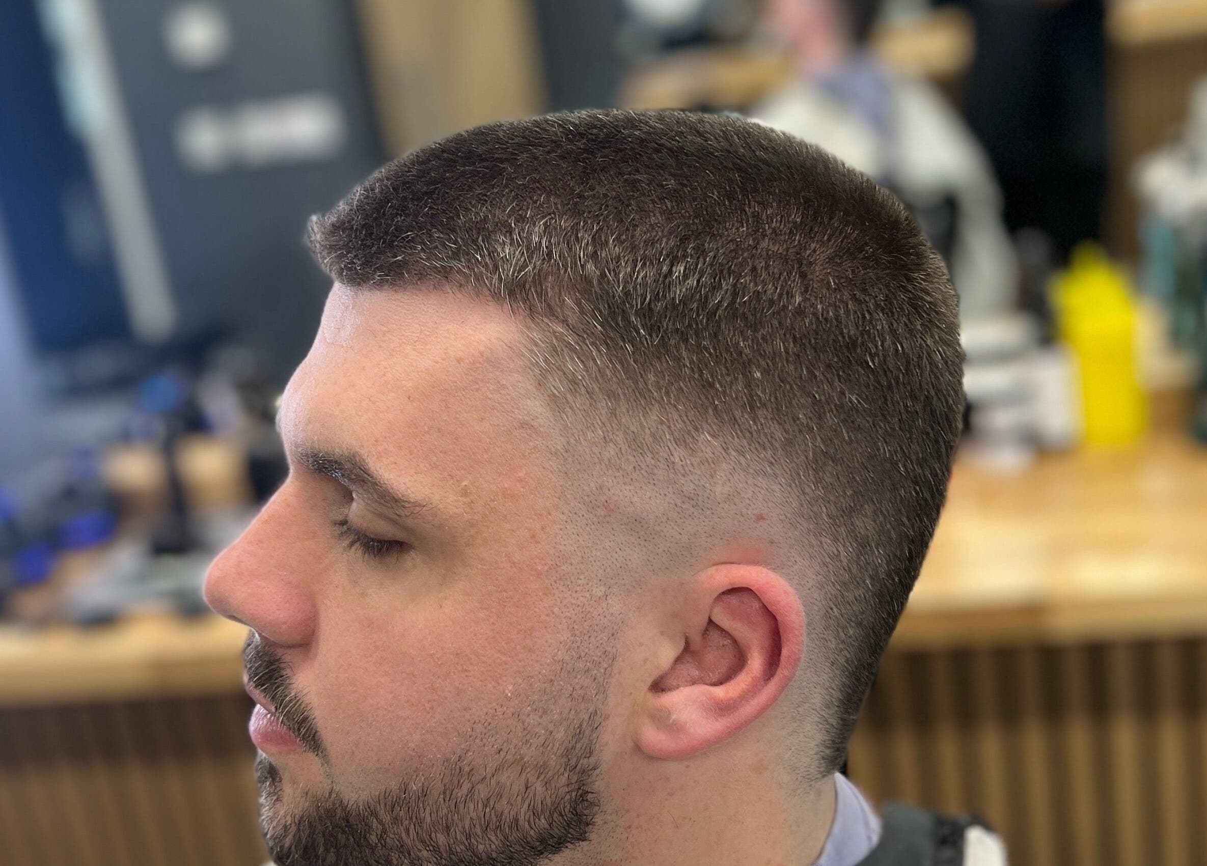 Client with stylish buzz cut at Moss Barber Studio, Llantrisant, Wales, GB.