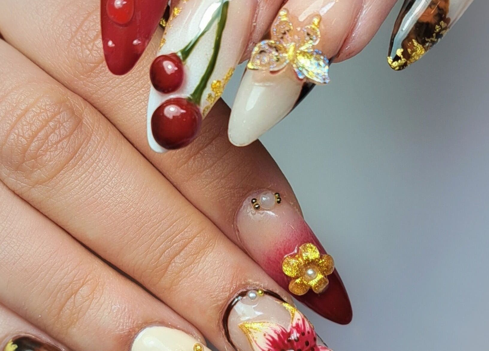 Elegant artistic nail designs at MB Beauty Nails, Spalding, England, GB showcasing unique nail art styles.