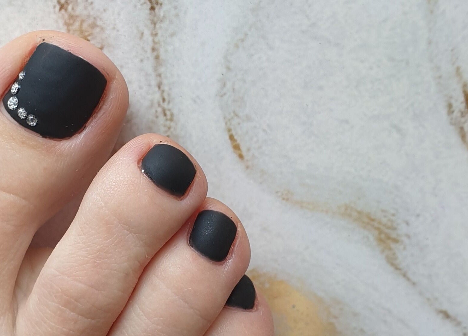 Black and gem nail art on toes at MB Beauty Nails, Spalding, England, GB.