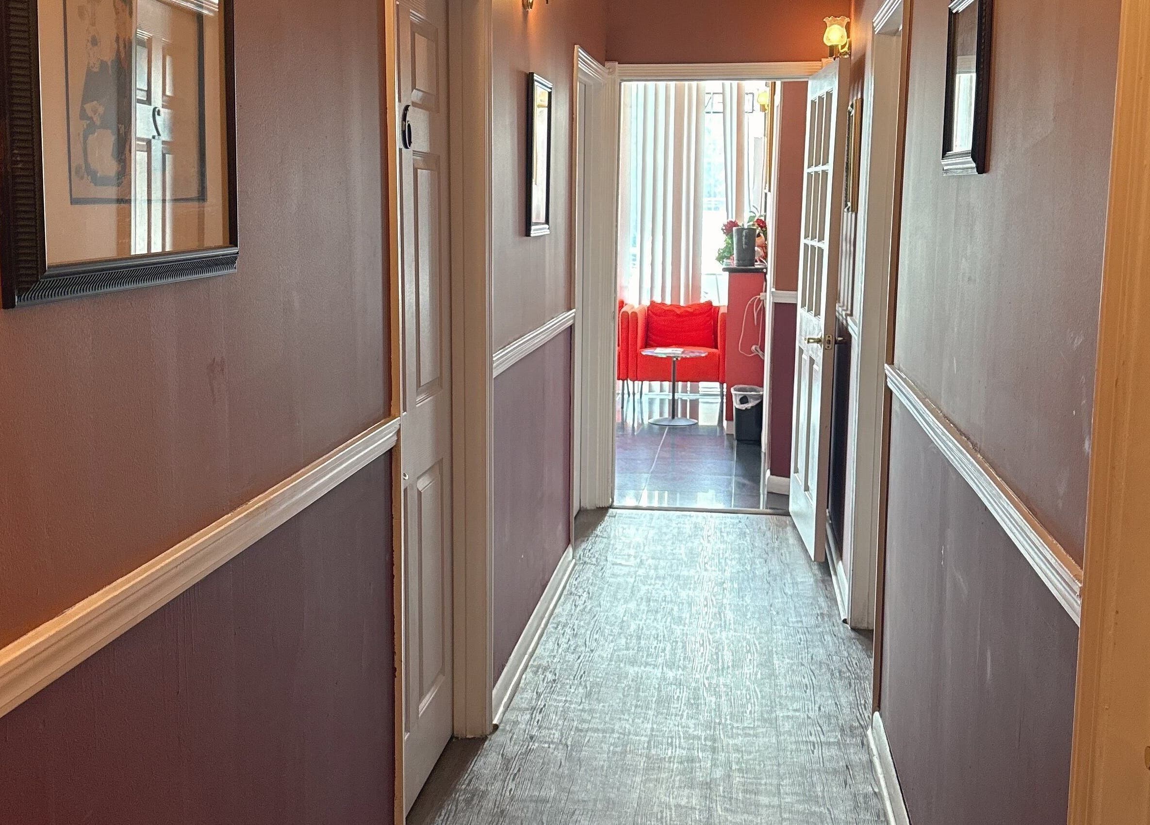 Inviting hallway at Hong Kong Massage, Fort Lauderdale, Florida, US, leading to a cozy reception area.