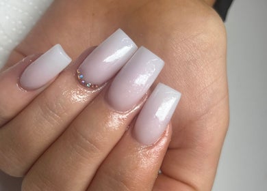 Elegant nail art with rhinestones at Beauty by Emily, Plymouth, England, GB showcasing expert design.