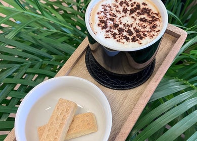 Relaxing coffee and biscuits at Lisa Campbell Hairdressing in The Lounge Hair & Beauty Ltd, Beachampton, England.