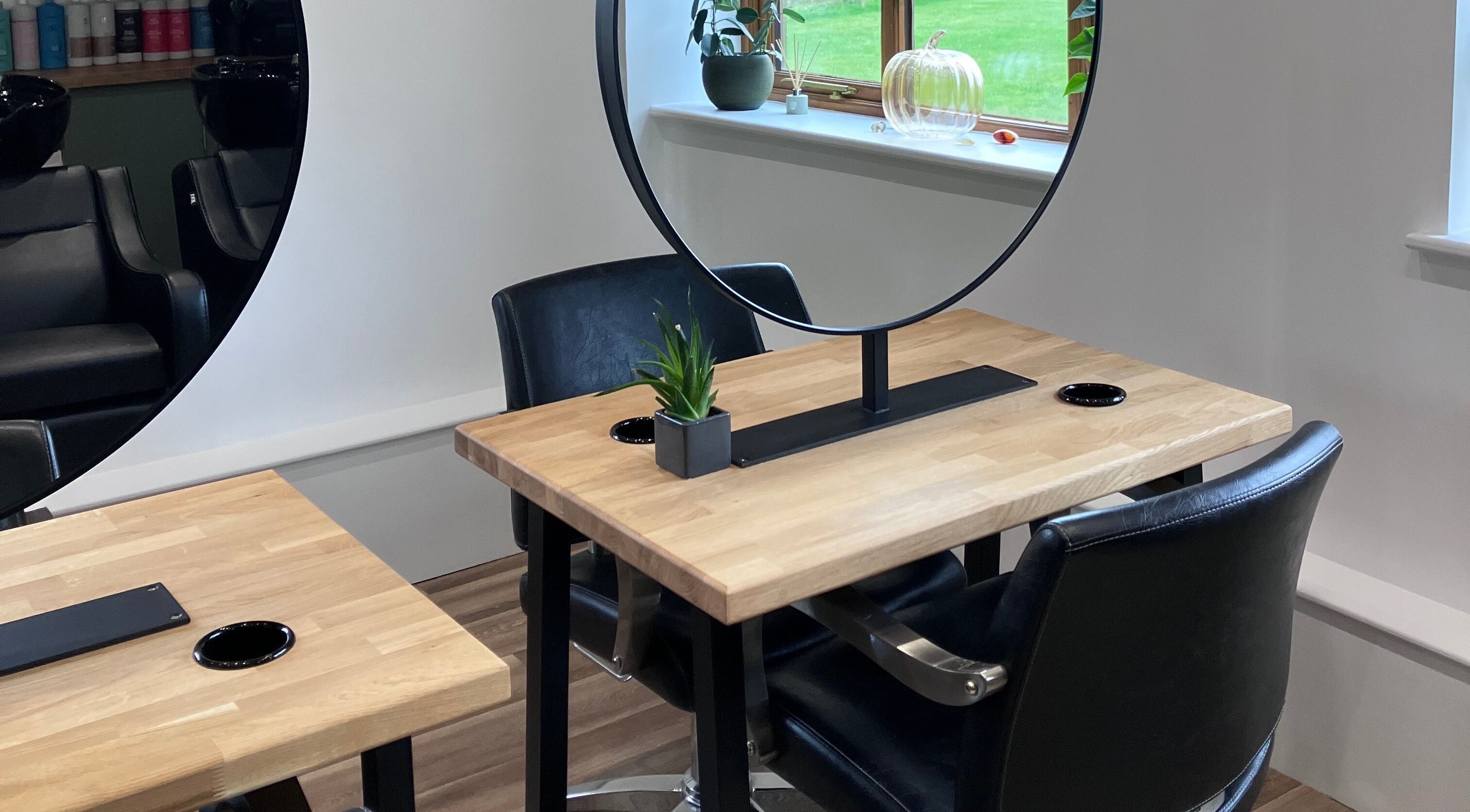 Modern salon station at Lisa Campbell Hairdressing at The Lounge Hair & Beauty Ltd Beachampton, England.