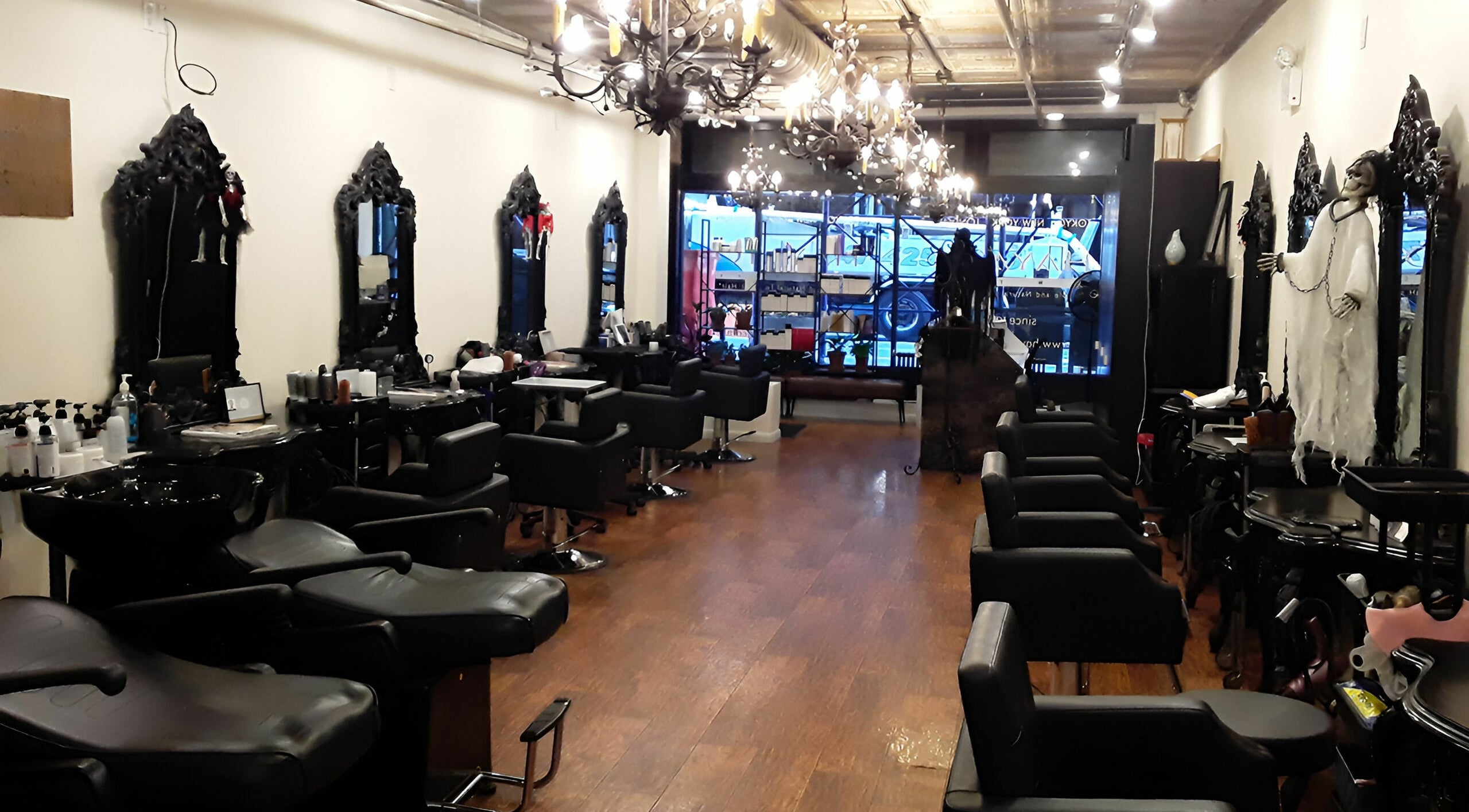 Elegant interior of Hayato New York salon in New York, New York, US with stylish chairs and mirrors.