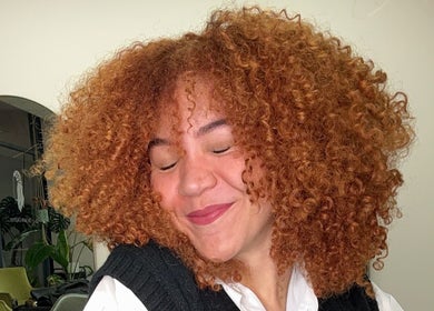 Smiling person with curly hair at Unique Hair Me - Curly Specialist, Arndell Park, New South Wales, AU.