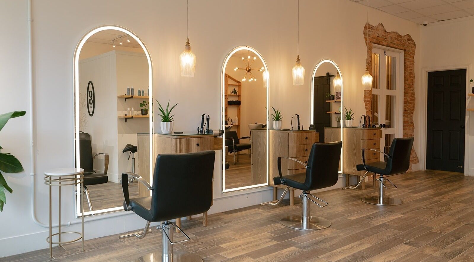 Elegant salon stations at Glow Hair Studio, Thorold, Ontario, CA with modern decor and cozy lighting.