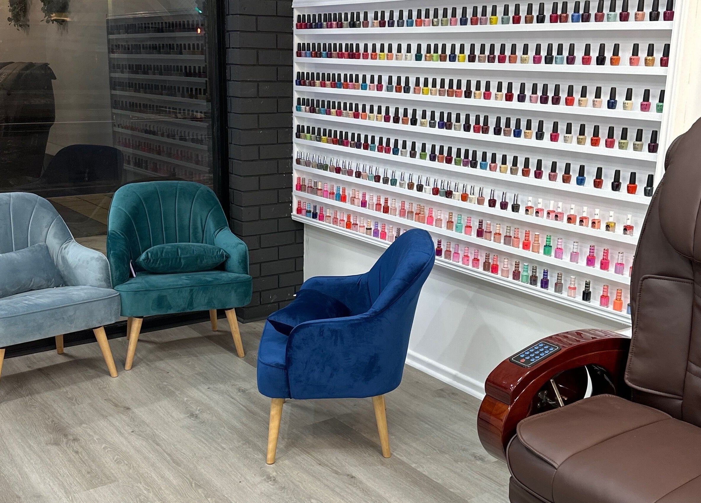 Jade Nails Spa in Woodville West, South Australia showcases vibrant nail polish options and plush seating for relaxation.