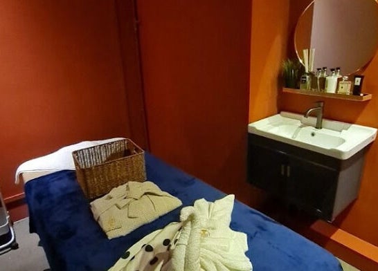 Relaxing treatment room at The Ruumah Spa Signature, Petaling Jaya, Selangor, MY, featuring soothing decor.