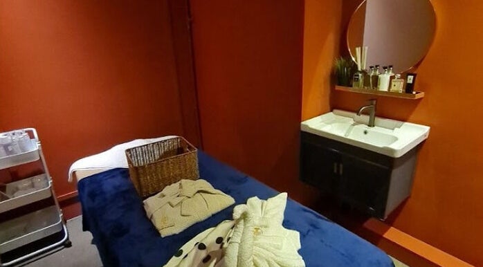 Relaxing treatment room at The Ruumah Spa Signature, Petaling Jaya, Selangor, MY, featuring soothing decor.