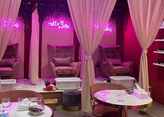 Lavish spa chairs under neon lights at The Ruumah Spa Signature, Petaling Jaya, Selangor, MY.