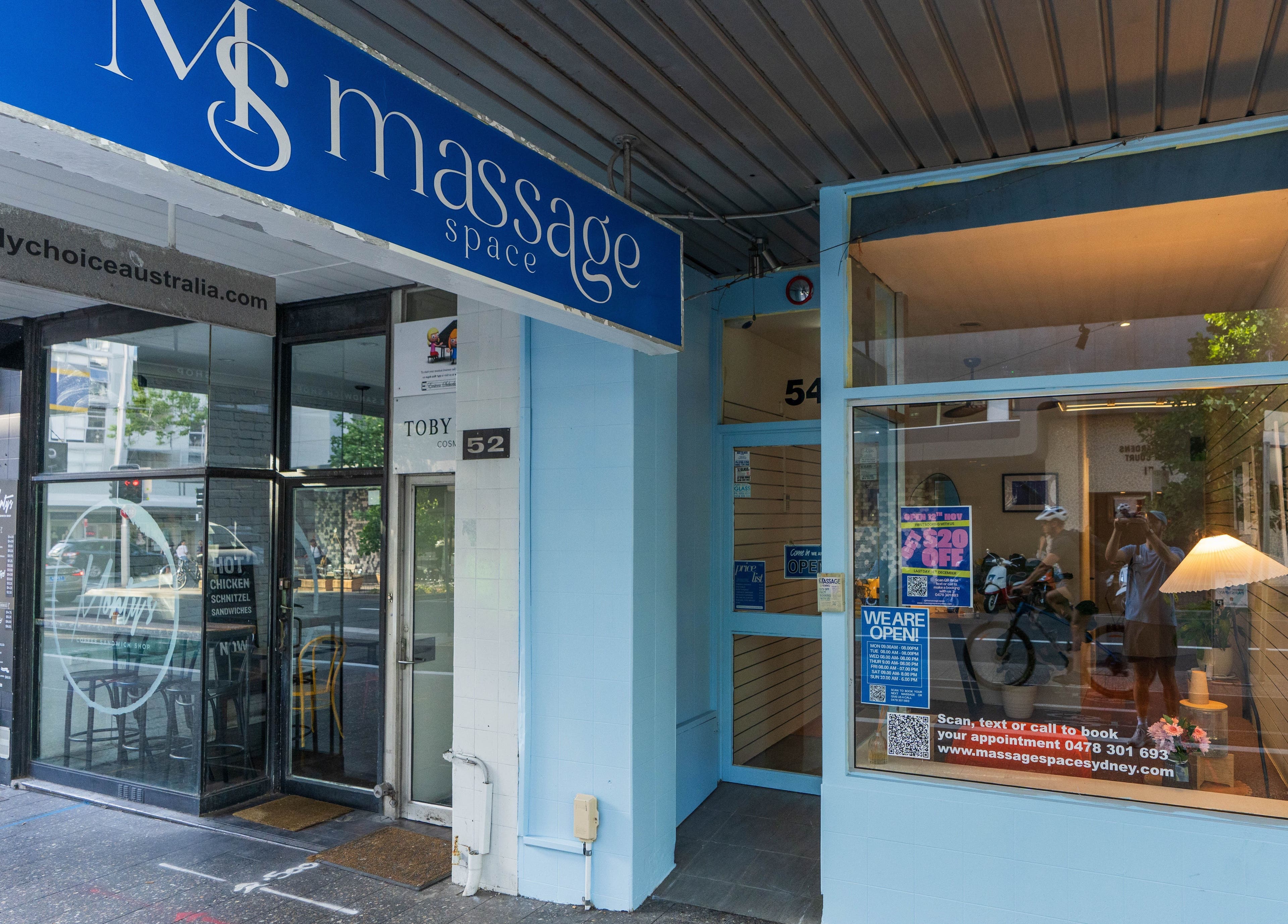 Front entrance of Massage Space in Bondi Junction, New South Wales, AU with a modern blue facade.