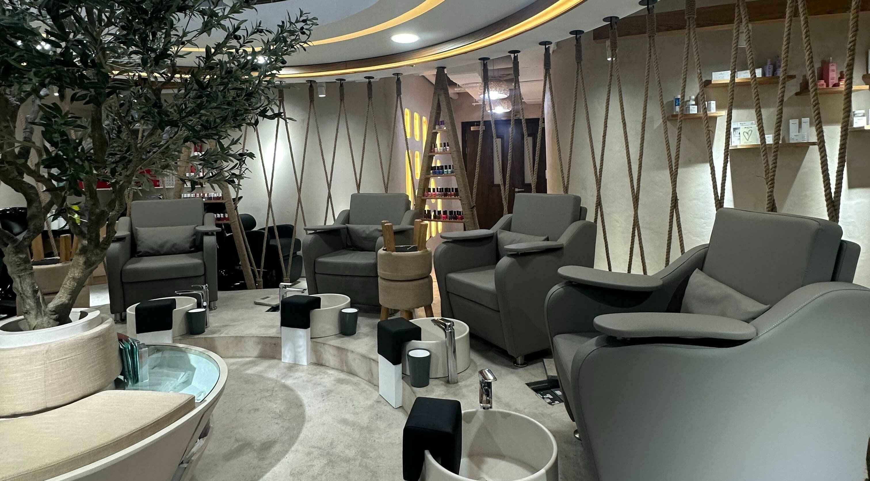 Chic pedicure area at Hola Ladies Beauty Center, Abu Dhabi, AE, featuring modern, comfortable seating.