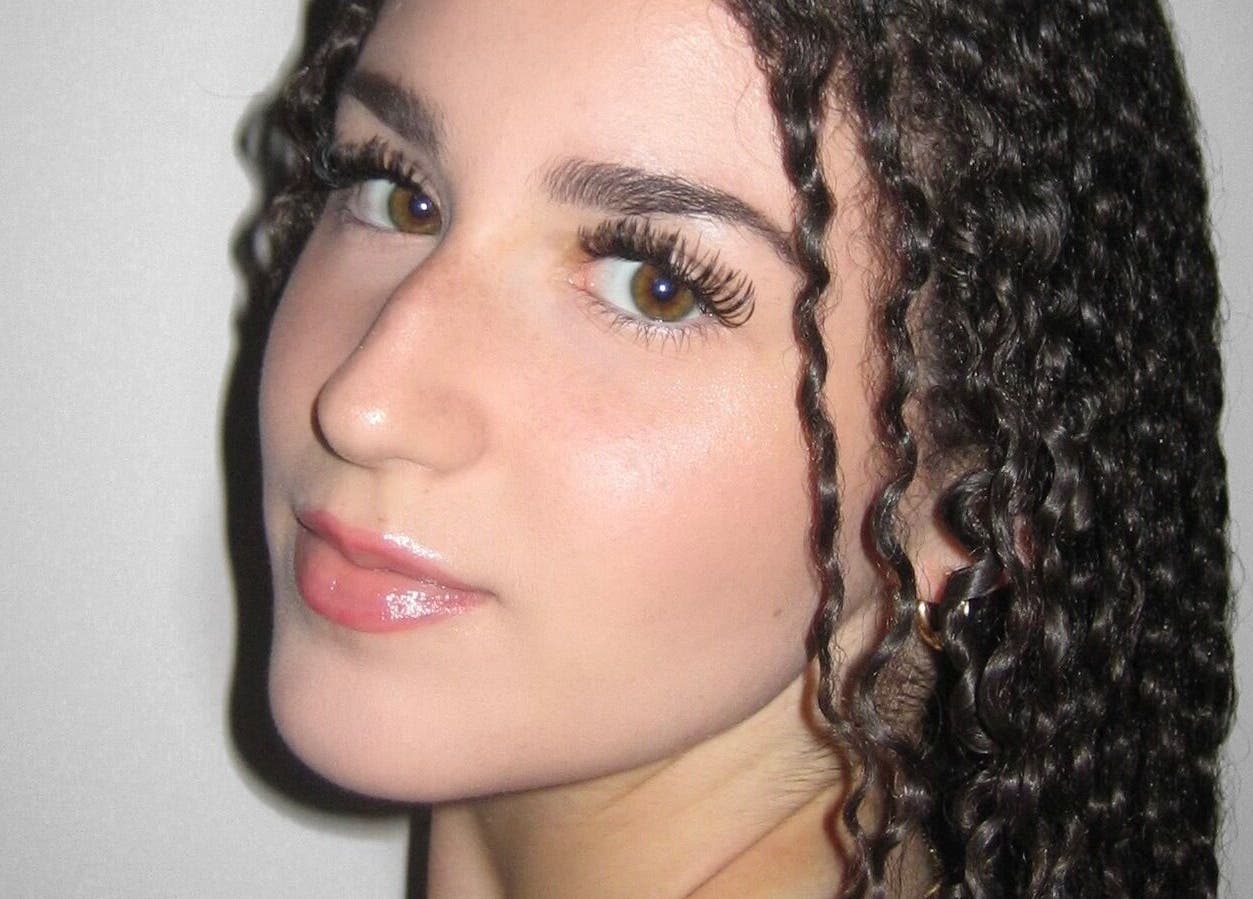 Close-up of a styled curly hair and natural makeup at Lashnbeauty Co in Vaughan, Ontario, CA.