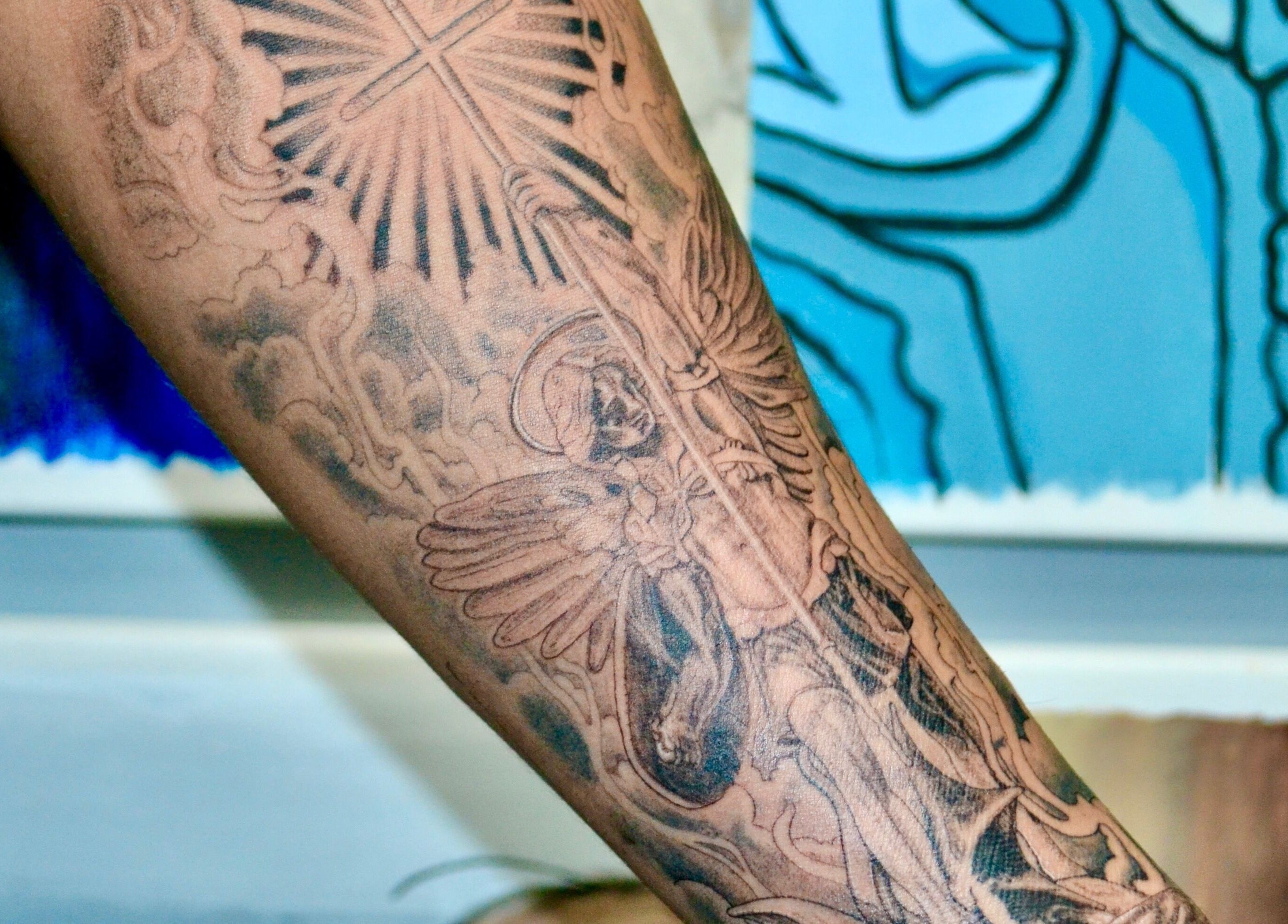 Detailed tattoo on arm at Casa Amor - Coming Soon in Hamilton, Ontario, CA.