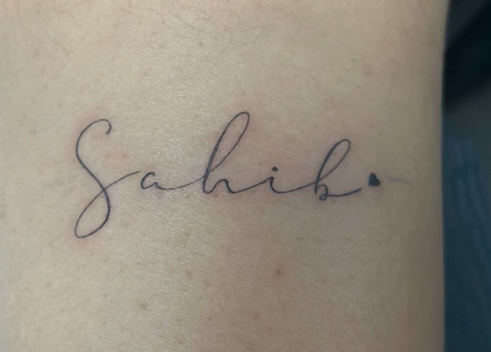 Elegant tattoo lettering at Casa Amor - Coming Soon, Hamilton, Ontario, CA, showcasing artistic script design.