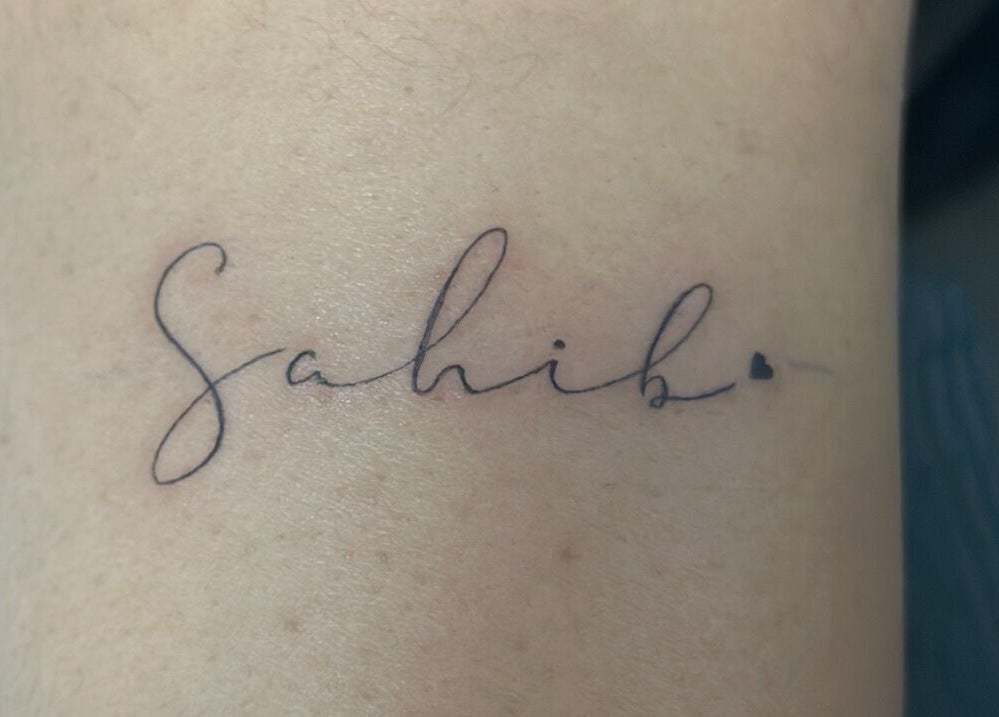 Elegant tattoo lettering at Casa Amor - Coming Soon, Hamilton, Ontario, CA, showcasing artistic script design.