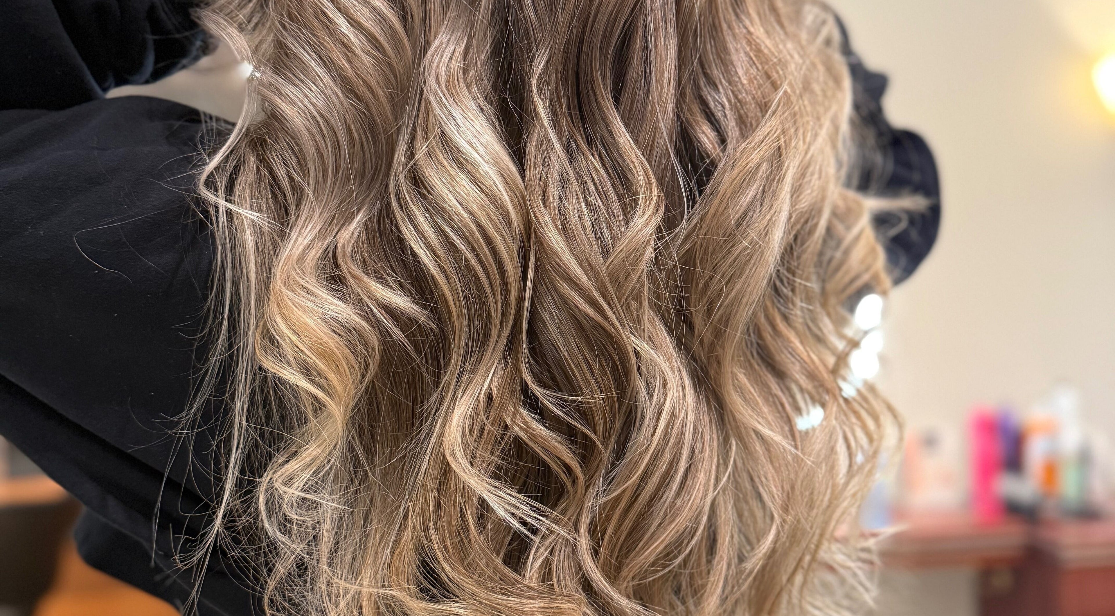 Lustrous wavy blonde hairstyle at Casa Amor - Coming Soon | Hair & Tattoos in Hamilton, Ontario, CA.